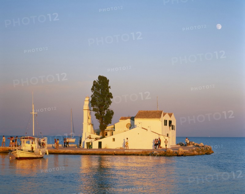 GREECE, Ionian Islands, Corfu, "Kanoni, south of Corfu Town.  Vlacherna Monastery.  Boat taking visitors to islet site of seventeenth century monastery."