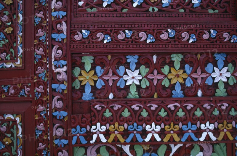 INDONESIA, West Sumatra, Architecture, Detail of highly decorated and carved door.