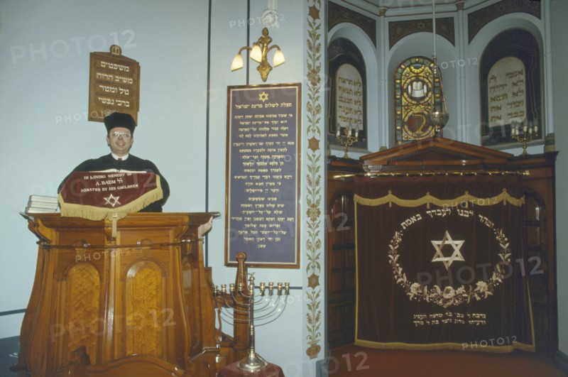 ENGLAND, Leicester, Interior of Leicester synagogue with Rabbi.