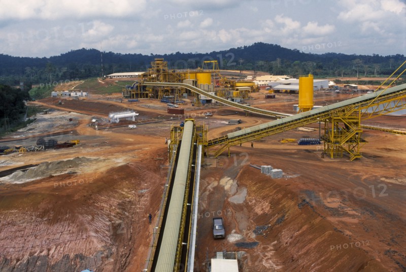 GHANA, Industry, Elevated view over gold mine and machinery.