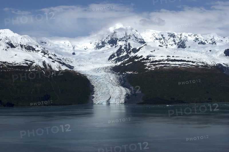 USA, Alaska, College Fjord, View over calm waters of the bay toward snow capped mountain range