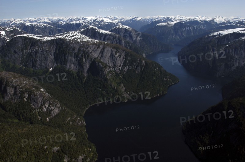 USA, Alaska, Misty Fjords Nat. Monument, Aerial view over river and surrounding rocky peaks