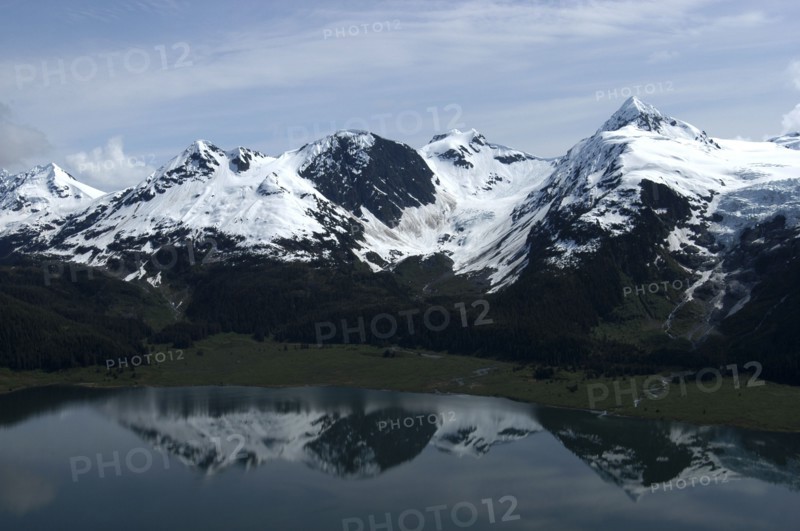 USA, Alaska, Prince William Sound, View over waters toward snow capped mountain peaks