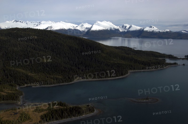 USA, Alaska, Prince William Sound, View along coastline toward snow capped mountain peaks