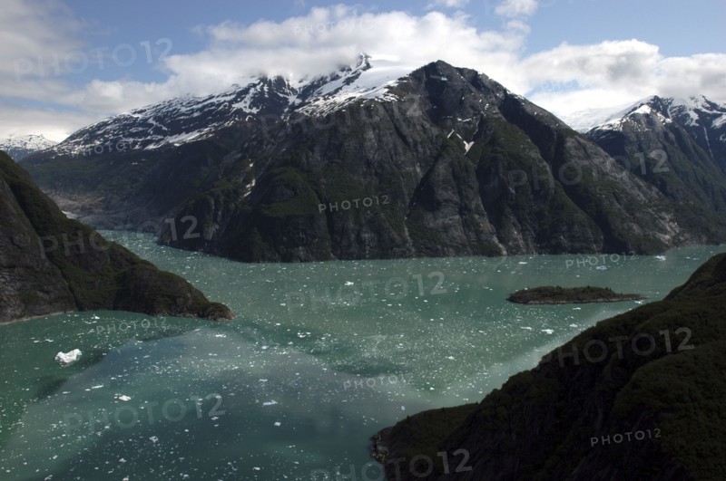 USA, Alaska, Tracy Arm Fjord, View over rocky cliff edged waterways toward mountain peaks