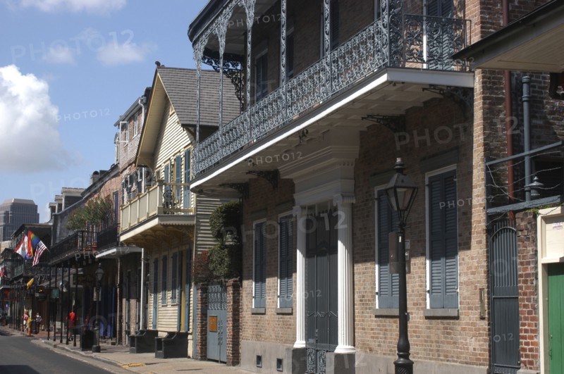 USA, Louisiana, New Orleans, French Quarter. View along buildings with ironwork balconies and shuttered windows
