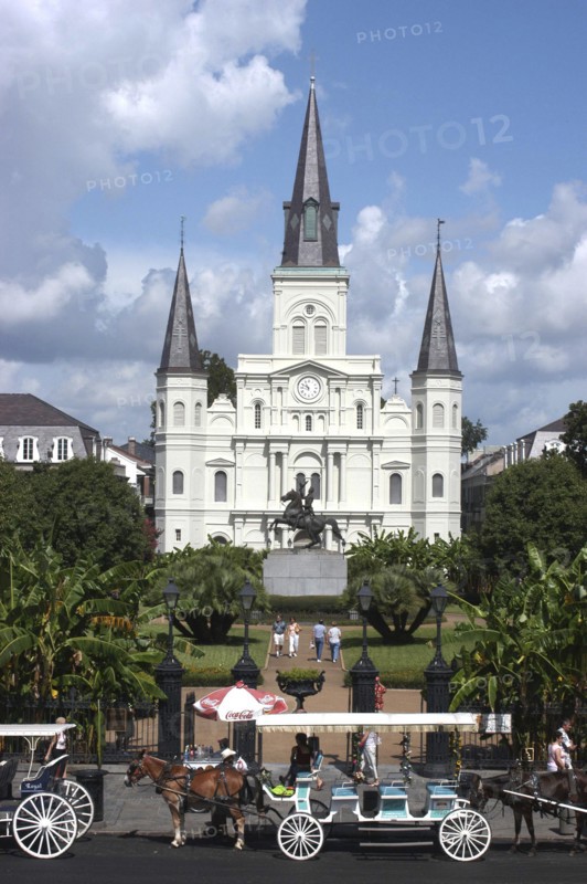 USA, Louisiana, New Orleans, French Quarter. St Louis Cathedral on Jackson Square with horse drawn carriages in the foreground