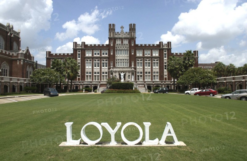 USA, Louisiana, New Orleans, Loyola University with word LOYOLA in white letters on the lawn in the foreground
