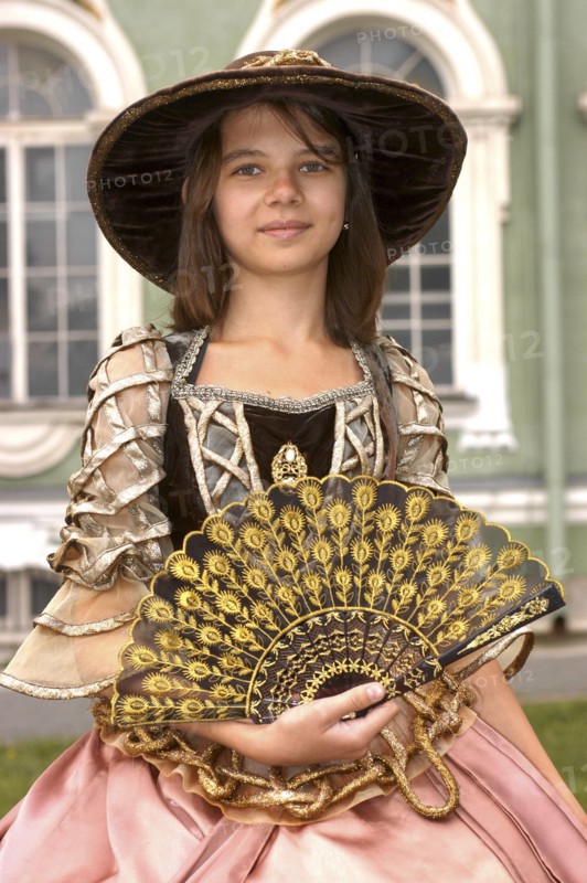 RUSSIA, St Petersburg, Portrait of a girl in historical dress with a hat and fan