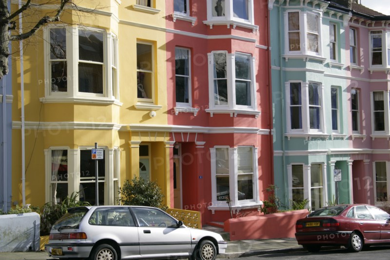 ENGLAND, East Sussex, Brighton, Brightly coloured terraced Kemp Town houses in Chesham Street