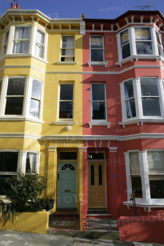 ENGLAND, East Sussex, Brighton, Brightly coloured terraced Kemp Town houses in Chesham Street