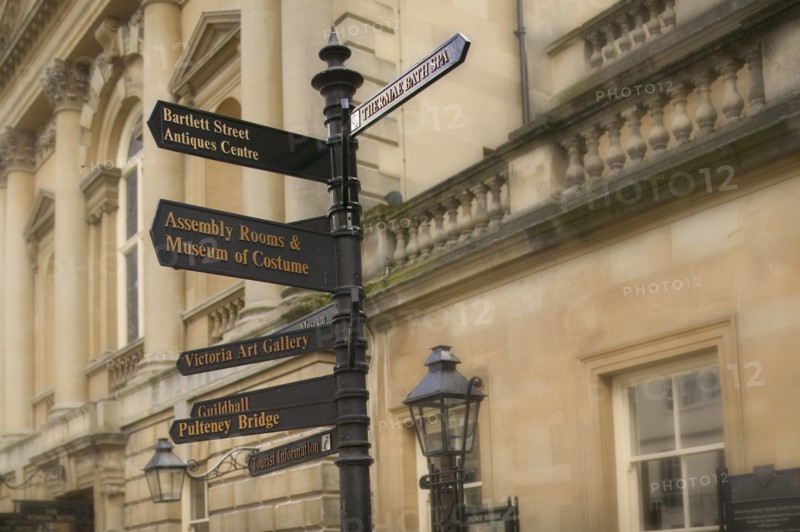 ENGLAND, Bath, Street signs outside the Pump Room.