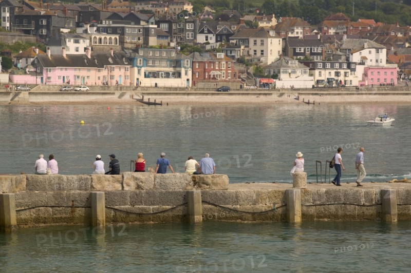 ENGLAND, Dorset, Lyme Regis, View of the town across the harbour from The Cobb.