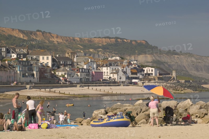 ENGLAND, Dorset, Lyme Regis, View of the town from the beach.