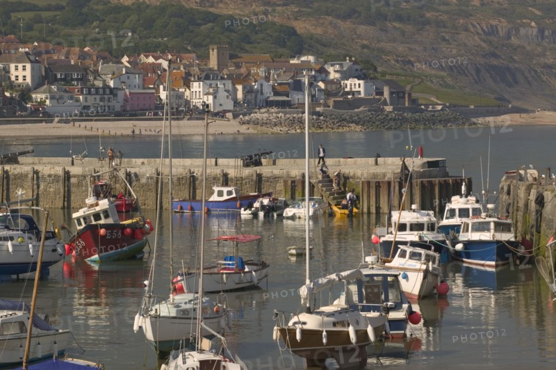 ENGLAND, Dorset, Lyme Regis, View of the town across the harbour from The Cobb.