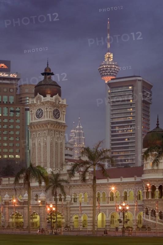 MALAYSIA, Kuala Lumpur, City centre skyline from Merdeka Square with The Sultan Abdul Samad Building in the foreground The Menara Kuala Lumpur  and Petronas Towers behind.