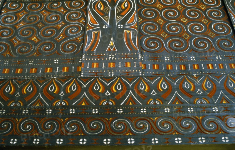 INDONESIA, Toraja, Detail of carving and painting in Toraja House.