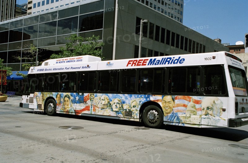 USA, Colorado, Denver, City bus beside building