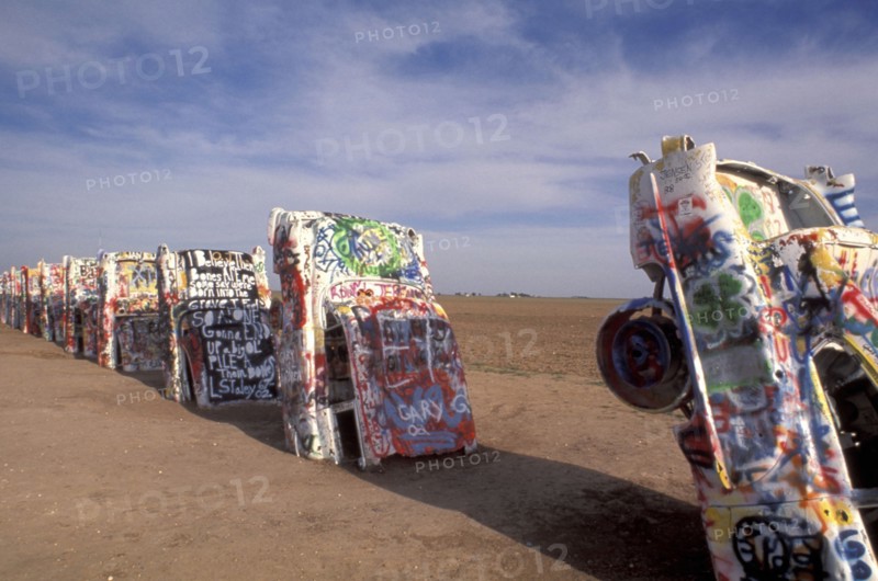 USA, Texas, Amarillo, Cadillac Ranch. Ten graffitied Cadillacs standing up ended in the soil