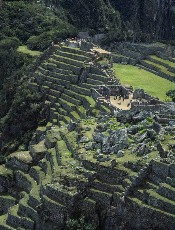 PERU, Cusco Department, Machu Picchu, View over the central plaza with main temple ruins and the walled terraces below