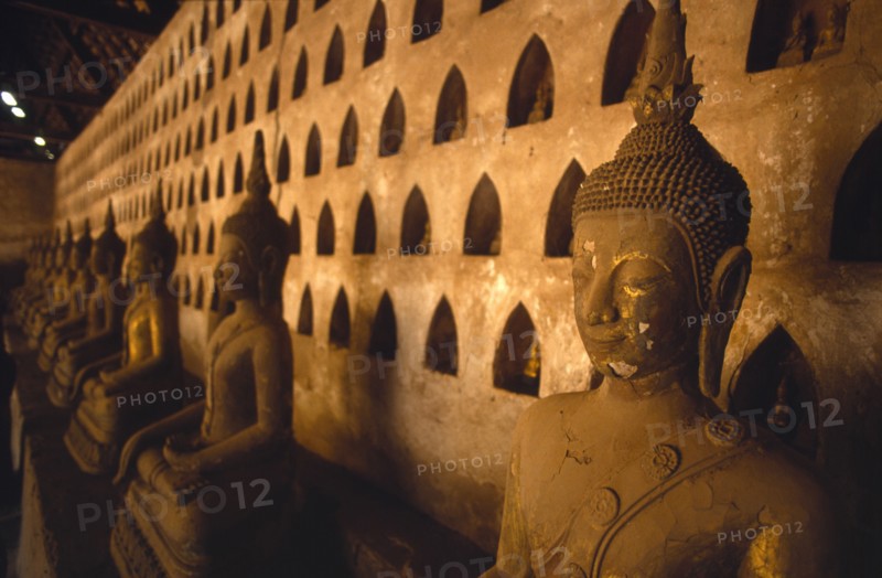 LAOS, Vientiane, Wat Si Saket.  Detail of Buddha figures in temple interior.