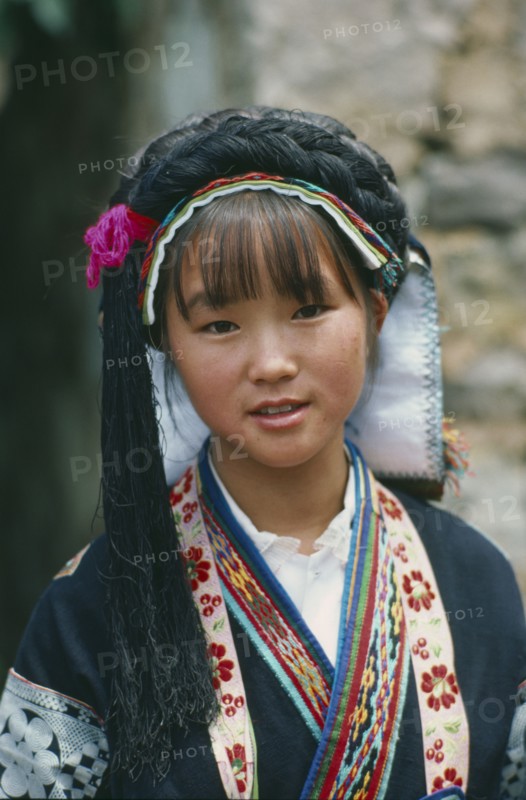 CHINA, Guizhou Province, Anshun District, Portrait of young woman of the Bouyei minority people.