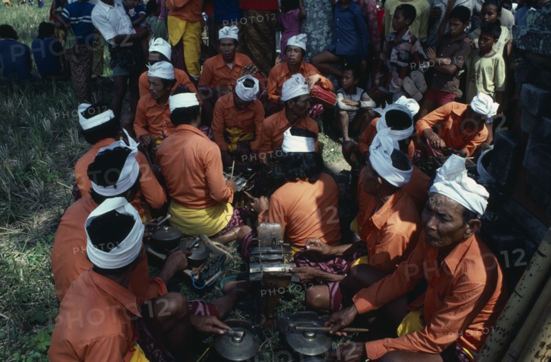 INDONESIA, Bali, Music, Gamelan orchestra playing at cremation ceremony.
