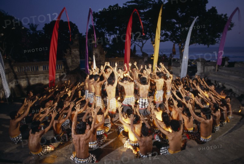 INDONESIA, Bali, Kechak dancers forming human mandala.  The Kechak dance tells the story of Prince Rama and his quest to rescue his wife Sita from the demon king Ravana.