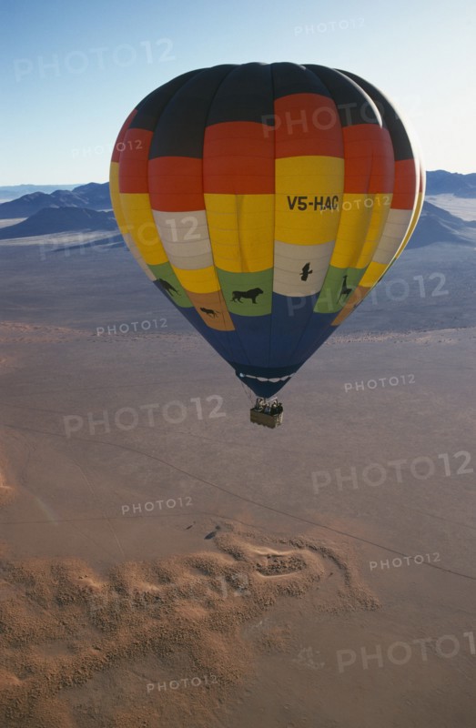NAMIBIA, Namib Rand Reserve, Hot air balloon above Camp Mwisho.