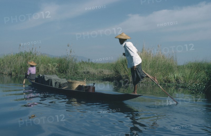 MYANMAR, Transport, Fishing boat rowed by oarsman using one leg.
