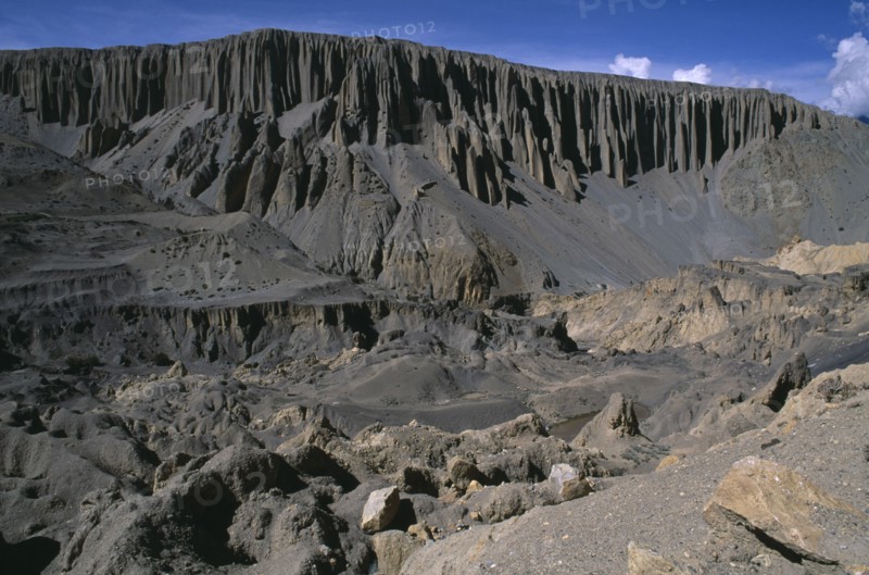 NEPAL, Mustang, Yara, Barren landscape with eroded cliffs creating organ pipe effect.