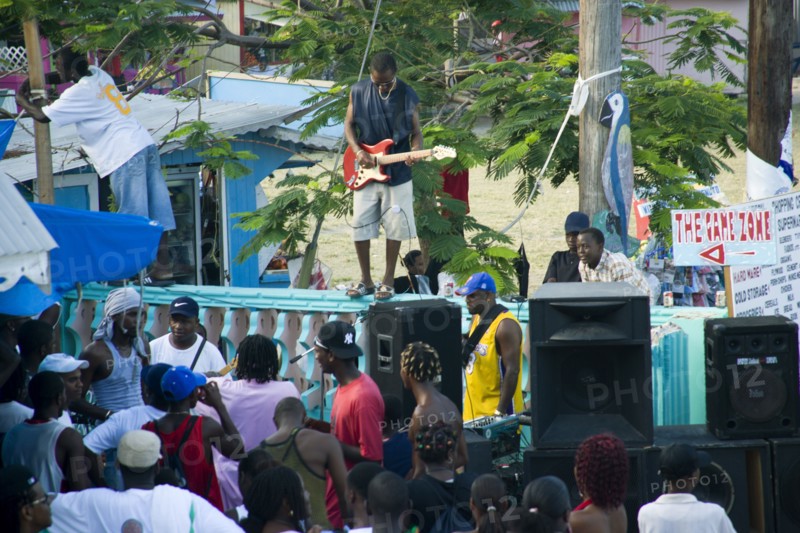 WEST INDIES, St Vincent & The Grenadines, Union Island, Guitarist and sound system at Easterval Easter Carnival in Clifton