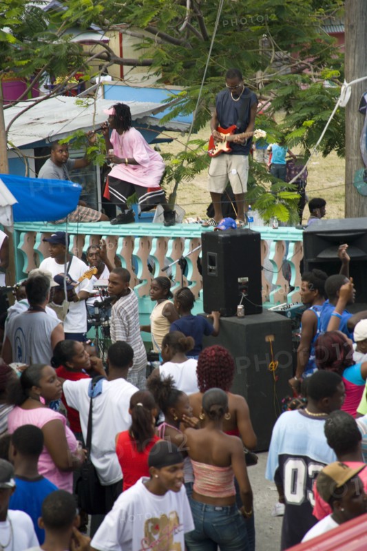 WEST INDIES, St Vincent & The Grenadines, Union Island, Singer and guitarist by sound system at Easterval Easter Carnival in Clifton