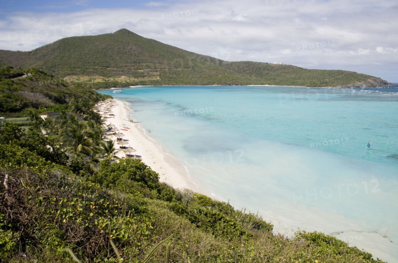WEST INDIES, St Vincent & The Grenadines, Canouan, Godahl beach at Raffles Resort with Mount Royal on the horizon