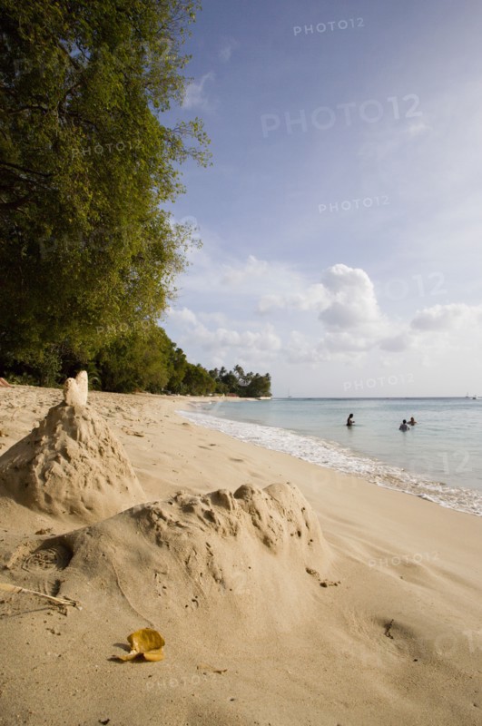 WEST INDIES, Barbados, St Peter, Gibbes Bay beach in the late afternoon with sandcastles at the waters edge