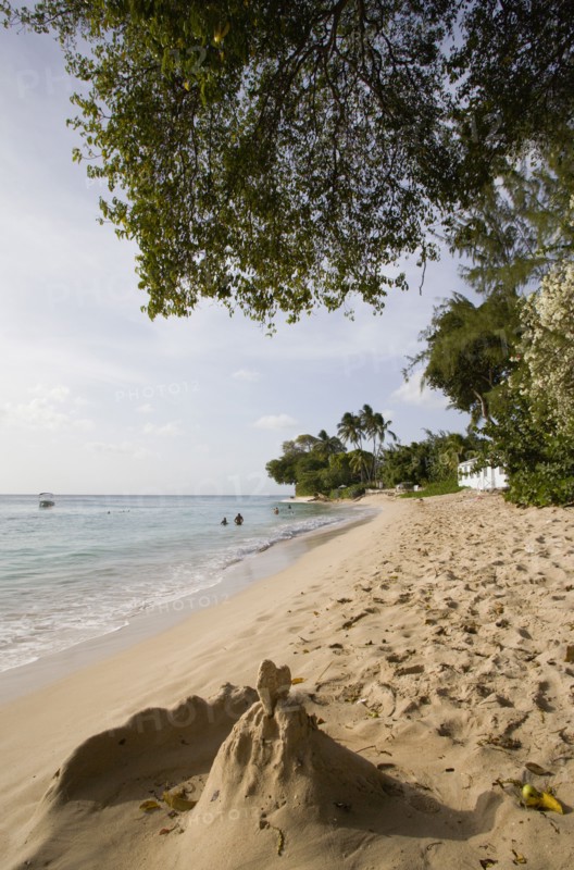 WEST INDIES, Barbados, St Peter, Gibbes Bay beach in the late afternoon with sandcastles at the waters edge