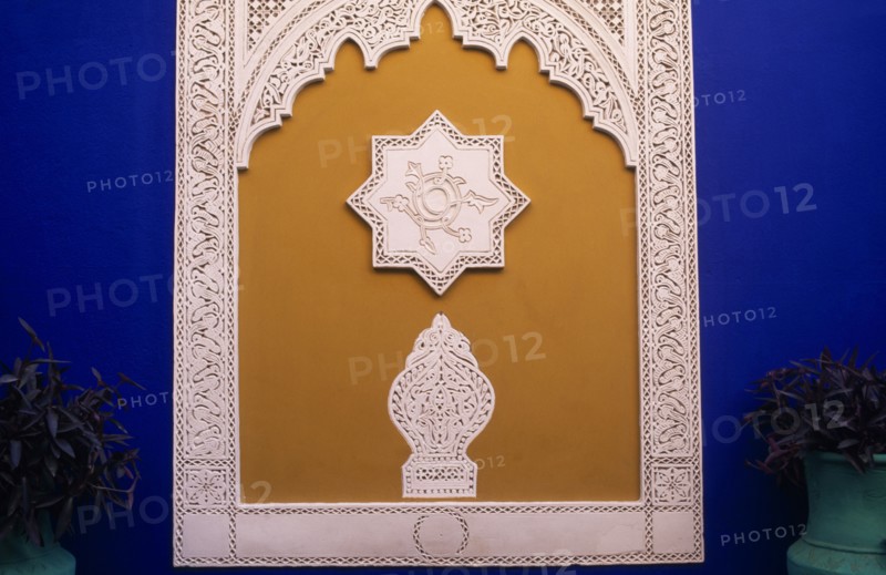MOROCCO, Marrakesh, The Jardin Majorelle owned by Yves St Laurent.  Detail of wall decoration.