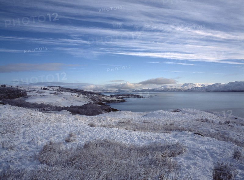SCOTLAND, Highland, Isle of Skye, View north east along the Sound of Sleat from Ard Thurnish in heavy snow.