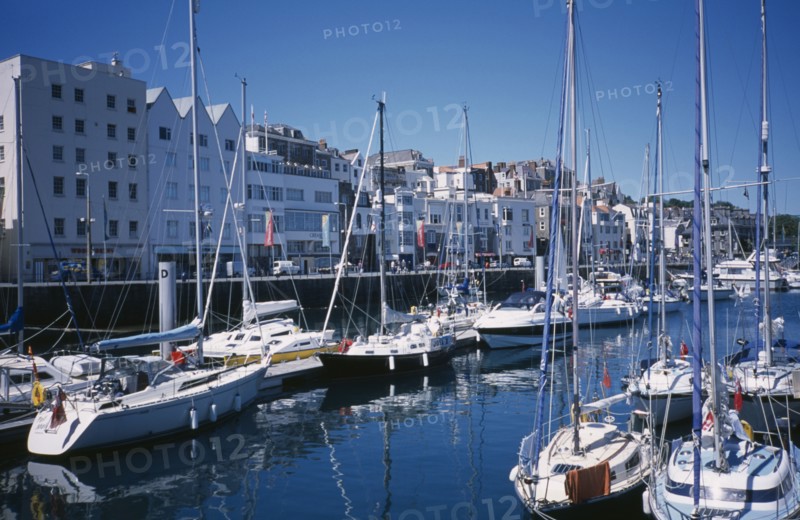 UNITED KINGDOM, Channel Islands, Guernsey, St Peter Port. Victoria Marina yachts and quayside buildings.