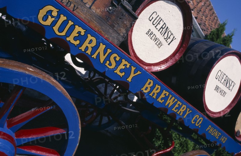 UNITED KINGDOM, Channel Islands, Guernsey, Forest Parish. German Occupation Museum. Detail of Brewery barrels on cart displayed outside main entrance.