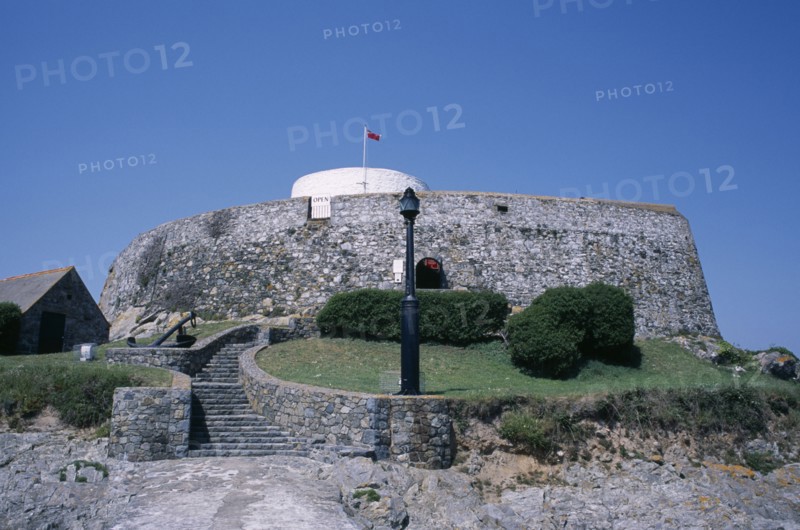 UNITED KINGDOM, Channel Islands, Guernsey, St Peters. Fort Grey Martello Tower and Shipwreck Museum. Also known as the Chateau de Rocquaine or the Cup and Saucer.