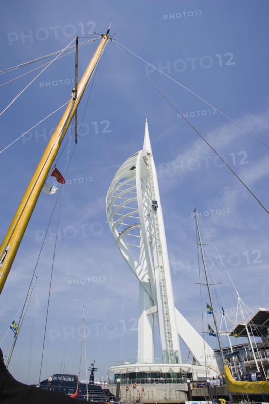 ENGLAND, Hampshire, Portsmouth, The Spinnaker Tower the tallest public viewing platforn in the UK at 170 metres on Gunwharf Quay with yachts mast in the foreground