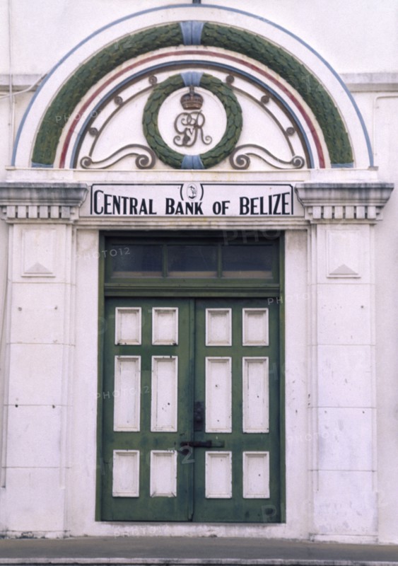 BELIZE, Belize City, The front door of the central bank with a crest in the archway above and columns either side.