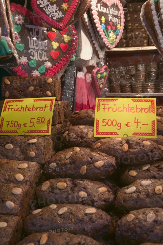 GERMANY, Bavaria, Nuremberg, "Stall selling Fruchtebrot and Lebkuchen, traditional German festive food, in the Christmas Market in Hauptmarkt."