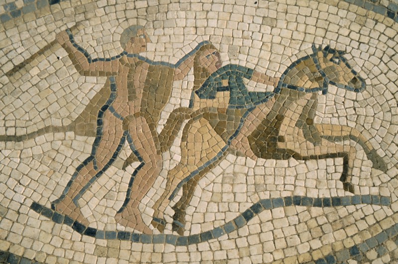 MOROCCO, Volubilis, Detail of mosaic depicting horseman and figure with club.