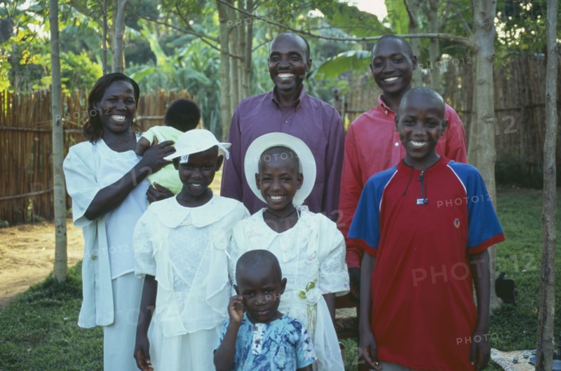 UGANDA, Family, "Husband, wife and six children dressed in Sunday best."