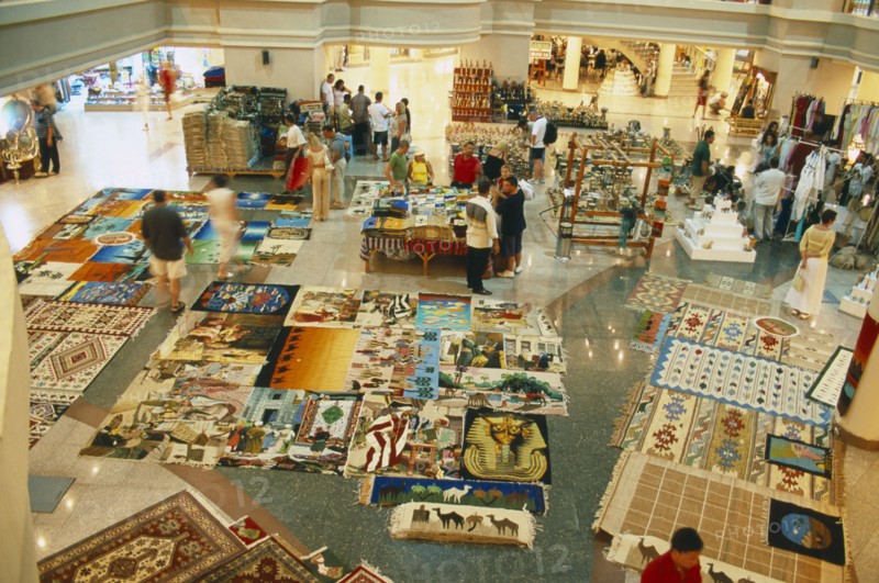EGYPT, Red Sea Coast, Sharm el Sheikh, "Naama Bay shopping centre, carpets laid out on display."