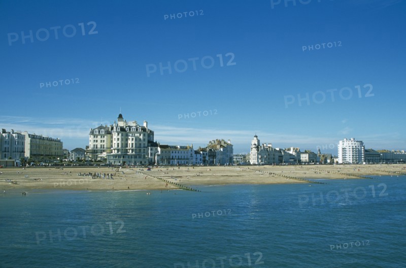 ENGLAND, East Sussex, Eastbourne, View across sea towards beachfront.