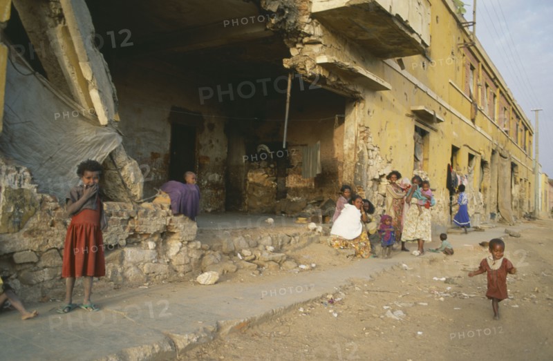 ERITREA, Decamare, Displaced women and children in war damaged building