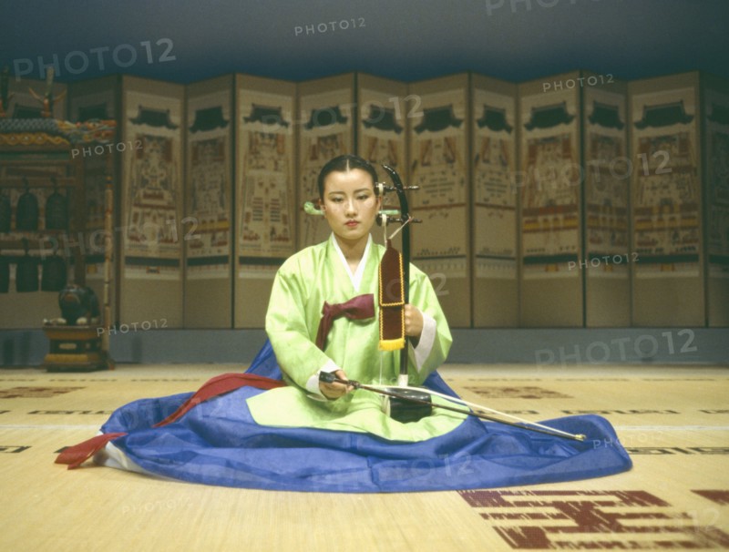 SOUTH KOREA, Seoul, Female musician at the Institute of Classical Music and Drama playing string instrument with bow.